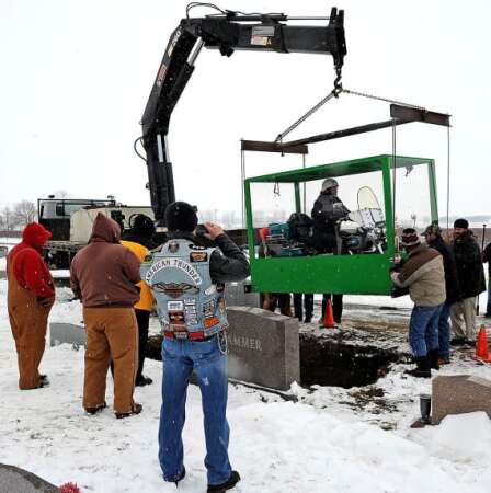 Billy Standley of Mechanicsburg, Ohio started planning to be buried on his 1967 Harley Davidson motorcycle about 18 years ago. His family carried out his wish Friday with a large Plexiglas casket at Fairview Cemetery in Mutual. MARSHALL GORBY / STAFF